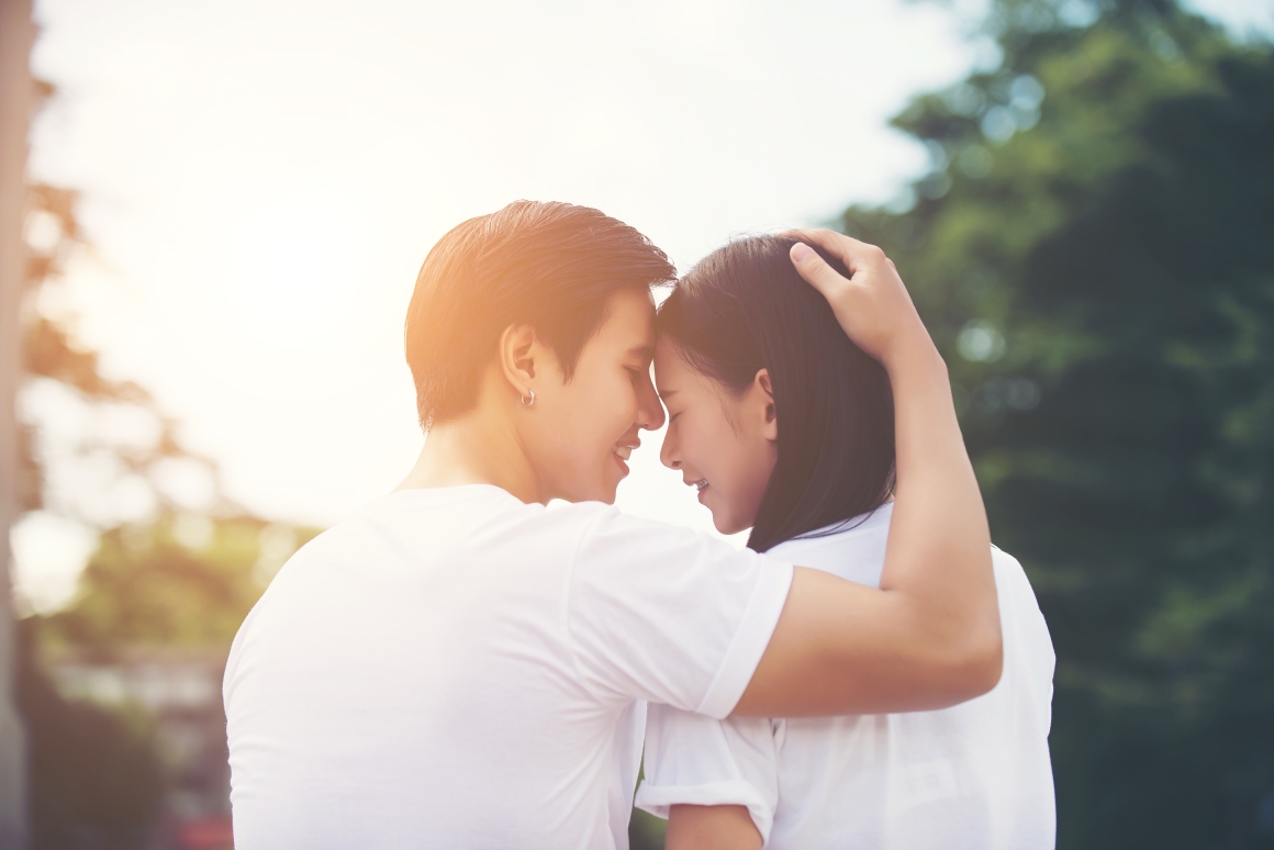 smiling-young-couple-love-outdoors